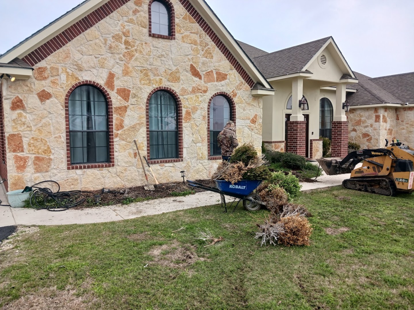 Stone-front home with landscaped beds, Seguin TX